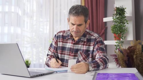Family man looking after food bills is having financial difficulties.