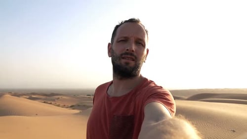 Tired Man Taking Selfie Photo, Recording Video on Desert Adventure
