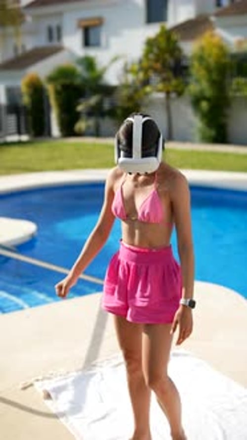 A Woman Exercises in VR Headset By the Pool for Fitness Training in a Residential Garden