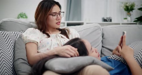 Relaxing At Home Together On Couch