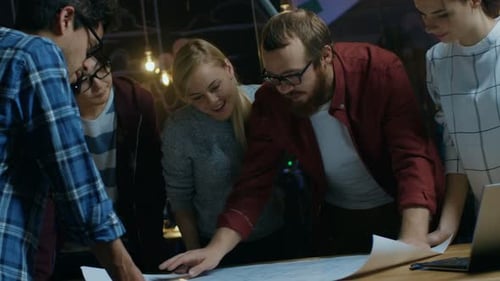 Team Collaborating on Project in Modern Office Space