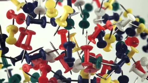 Multicolored Paper Clips Fly Up and Fall Down Filmed on a Highspeed Camera at 1000 Fps
