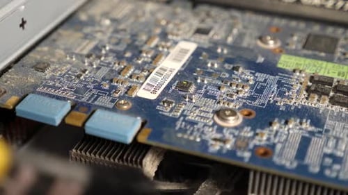 Dusting a Computer Circuit Board Close-Up