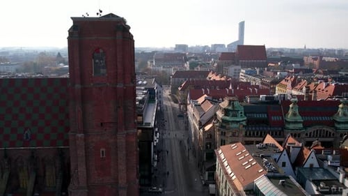 Old Architectures On The Cityscape With People Walking On The Road In Wrocław, Poland. Aerial Shot