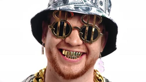Man Smiling Wearing Dollar Sign Glasses and Grill