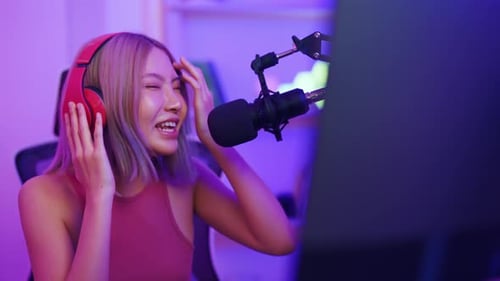 Woman Singing Passionately Into Microphone With Headphones