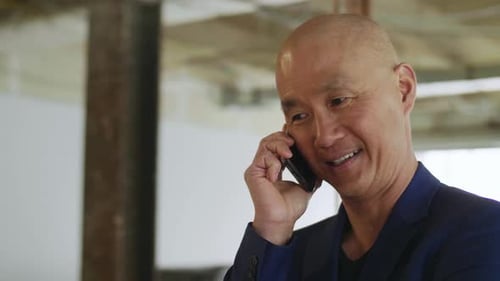 Architect Discussing Office Remodel on Phone Adult