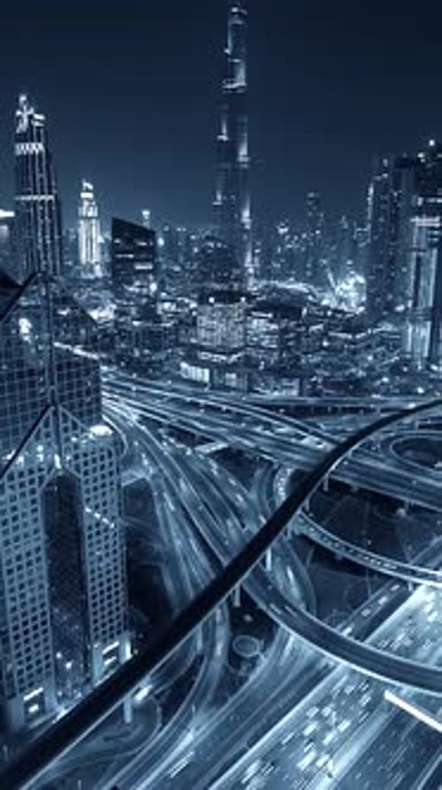 A Stunning Nighttime Cityscape with Iconic Skyscrapers and Busy Highways That Amazes