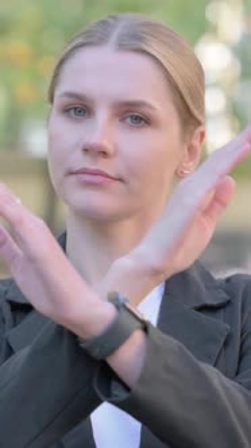 Outdoor Portrait of Rejecting Businesswoman in Denial, vertical
