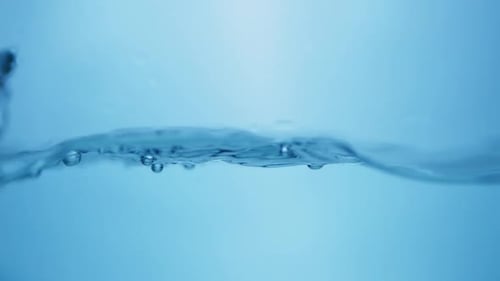 Refreshing Blue Waves. Abstract Water Background with Splashing Bubbles. View of Fresh Water Droplet