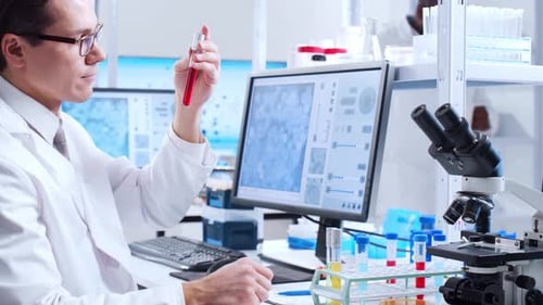 Scientist Analyzing Sample in Bright Laboratory Setting