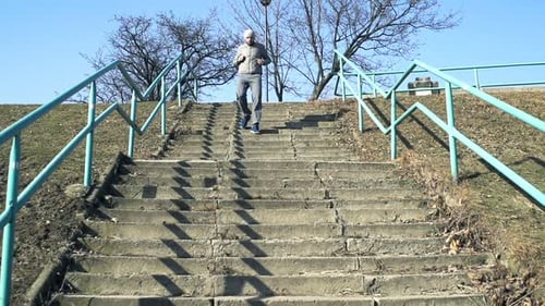 Man Running Down On Stairs In City