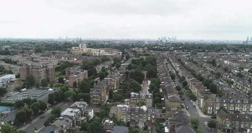 Aerial forward tracking shot over north London.