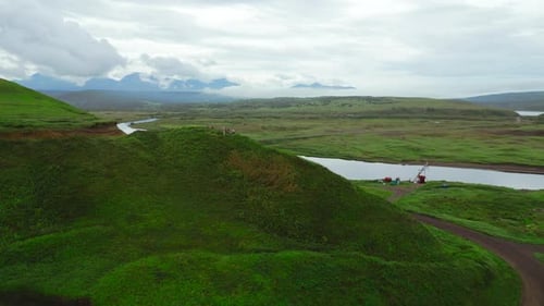 The Bridge with the River and Green Valley As a Backdrop Clip Aerial View of Summer Green Valley and