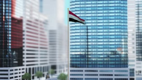 Yemen Flag Waving Against Modern Corporate City