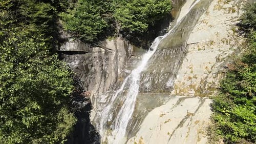 waterfall flowing over the rock nature