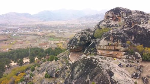 Rock climbers climbing on a cliff drone shot. Adrenaline. Speleology.