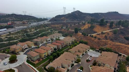 Aerial View of Suburban Homes Near Highway