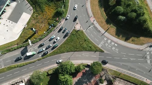 Vehicles Stopping at a Traffic Light Controlled Roundabout System