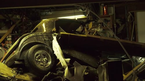 wrecked car in driveway -