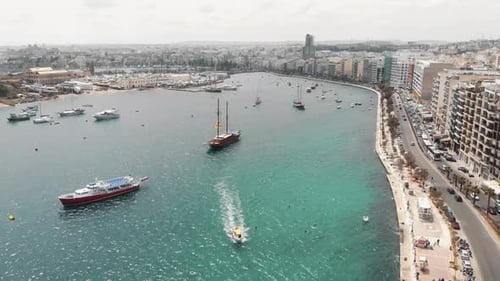 Aerial 4k drone footage of a harbor of the Mediterranean tourist resort town of Sliema, Malta.