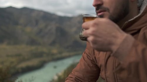 Hiker Tourist Traveler Man Drinking Hot Thermos Cup Tea Mountain Camping Camp Tent Traveling Hikingю