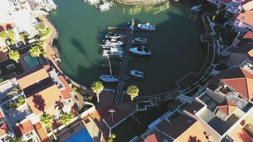 Drone, property and boats in harbor water for travel, luxury apartment or residential housing