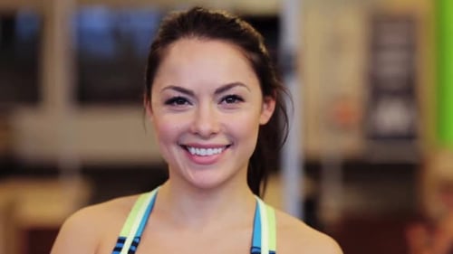 Sport, Fitness, Emotion, Expression And People Concept - Happy Smiling Young Woman At Gym