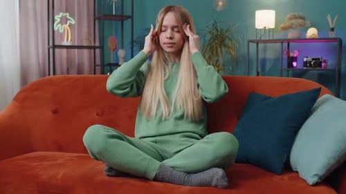 Displeased Caucasian Woman Rubbing Temples to Cure Headache Problem Suffering From Migraine Stress