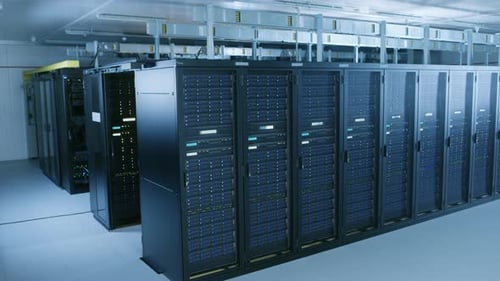 Descending Shot of Data Center With Multiple Rows of Fully Operational Server Racks. Modern Telecom