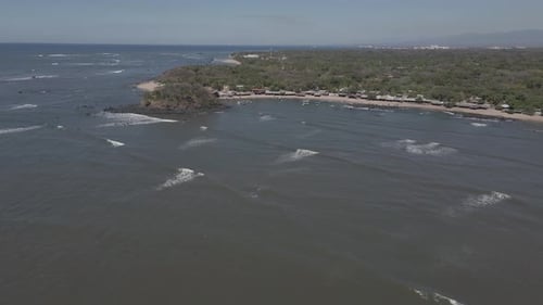 Near Shore Flight Low Tide Surf Waves Along idyllic Beach in Central America