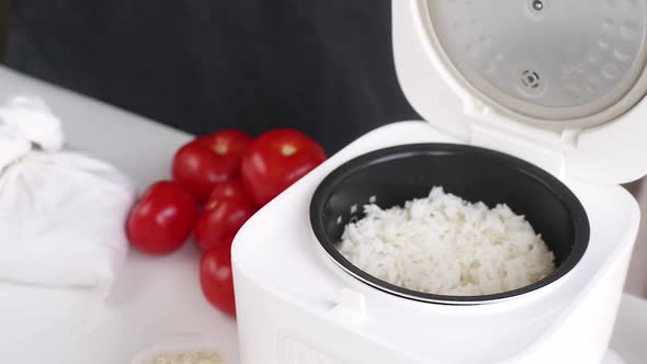 man cooking rice using Electric rice cooker, Food Stock Footage ft ...