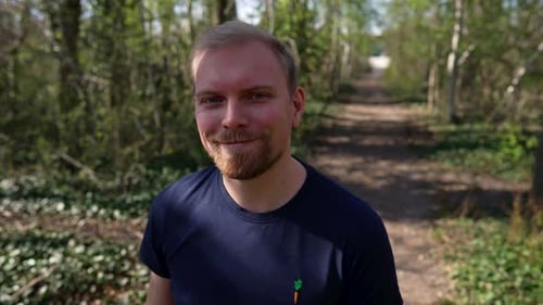 Happy, Confident Caucasian Man Takes of his Glasses, Medium Shot, Outside in Nature