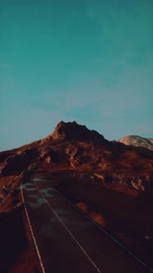 Empty Road Leading to Scottish Mountain
