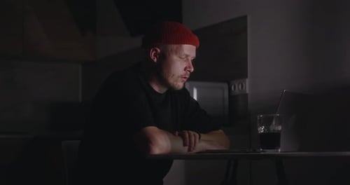 A Person Looks at the Laptop Screen and Cannot Find a Mistake in the Project