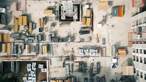 Aerial Flight Over a New Constructions Development Site. Urban Construction Site, Aerial View. High