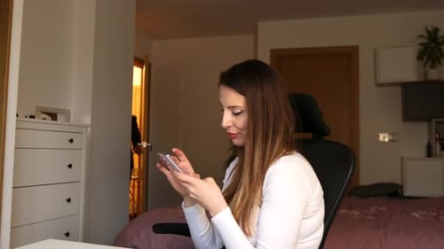 Indoor conflict scene, woman hitting man with bouquet, rejection, blurred motion