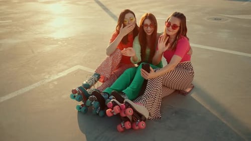 Happy Women in Retro Rollers Filming Video About Lifestyle