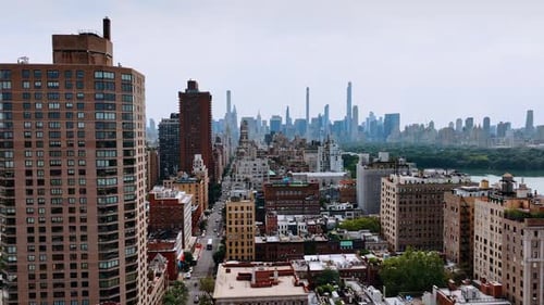 Bright New York cityscape on beautiful sunny day. Skyscrapers skyline at backdrop. Top view.