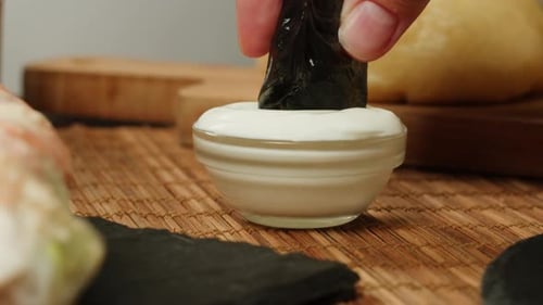 Dipping Dimsun Into White Sauce Closeup Macro Dim Sun Gedza Dumplings Spring Rolls on the Table Food