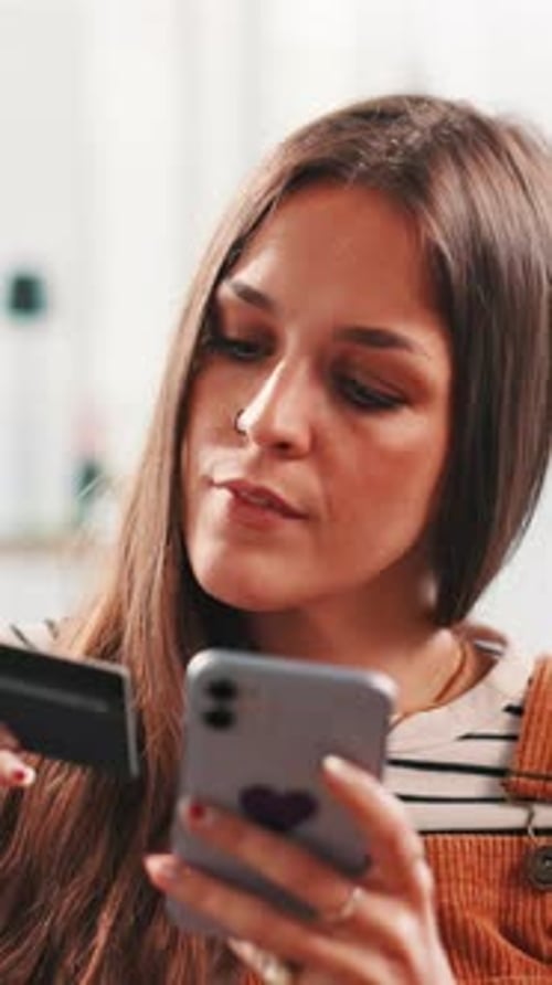 Woman Enters Credit Card Info on Phone
