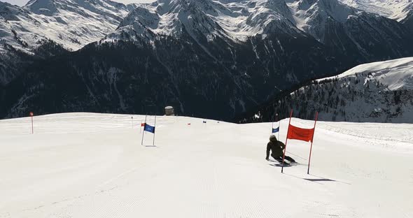 Ski racing in ski gates on a race slope with unbelievable view over the ...