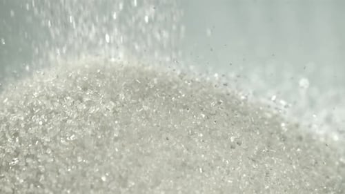 Sugar Falls on the Table in a Heap Filmed on a Highspeed Camera at 1000 Fps