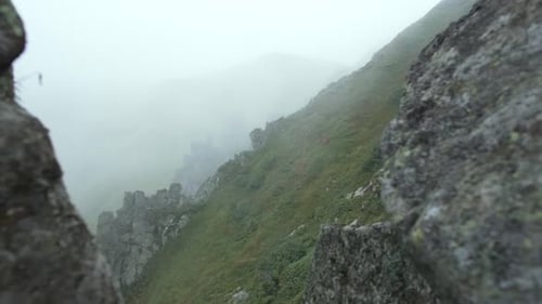 Fog in the Mountains Rocky Landscape on the Alpine Meadows on a Cloudy Day
