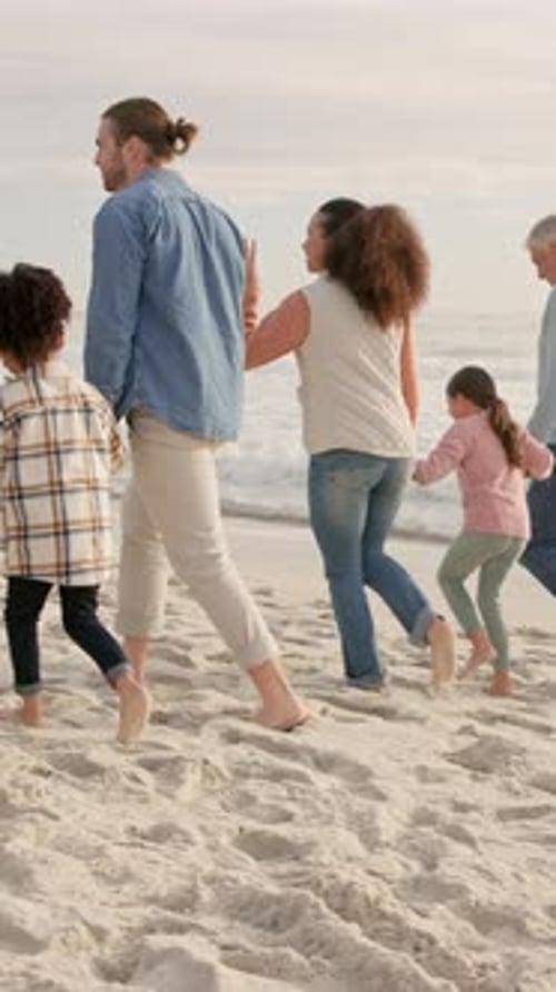 Beach, big family and holding hands on walk for holiday, bonding or talk with grandparents