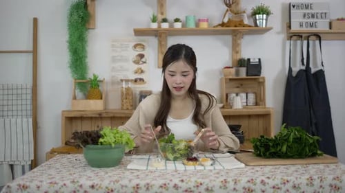 Woman Making Salad in Bright Kitchen