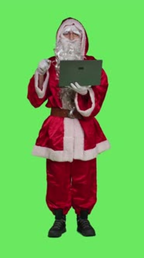 Vertical Video Front View of Santa Claus Cosplay Works with Laptop