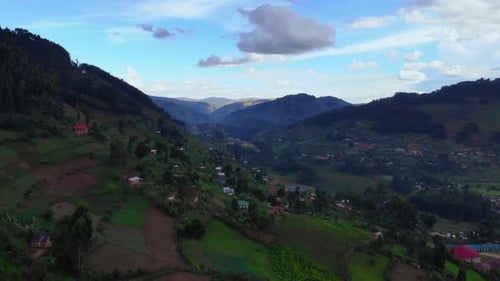 Calm Evening In Mountainous Terrain Featuring Stepped Farms And Meandering Trails Behind Moody