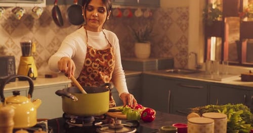 Young Couple Cooking Together in Cozy Kitchen