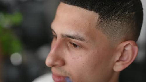 High Angle View Closeup Young Middle Eastern Man Doing Eyebrows Shaping in Beauty Parlor Caucasian